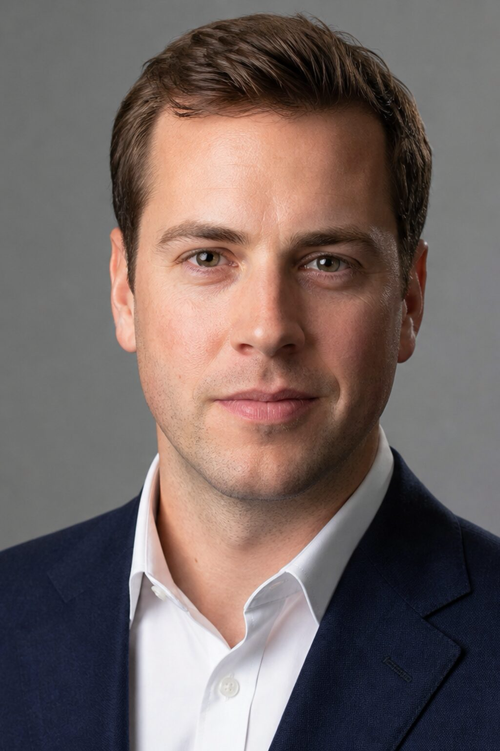 A single mains-powered strobe in a medium softbox at front-45° — the cleanest studio portrait recipe before adding rims, grids, or second lights