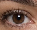 Three very tight views of the same woman’s lit eye, one for each of three key positions: 0.0, 27.5 and 39.1 degrees off the lens axis to camera-left. In the first, the small bright reflection of the light sits directly above her pupil. In the second it has moved round toward the side of the iris nearest the light. In the third it is further round and further out from the centre again, while staying at very nearly the same height in the eye.