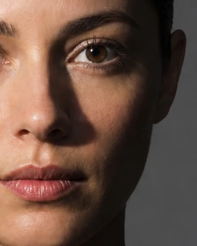 Naming the pattern — a lit face, cropped close: frame 2 of 3
