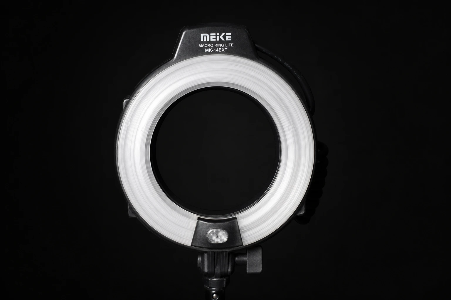 Ring flash, rigged as it is used — Ring flash sits around the lens axis, producing flat, glossy beauty light with a signature ring catchlight in both eyes