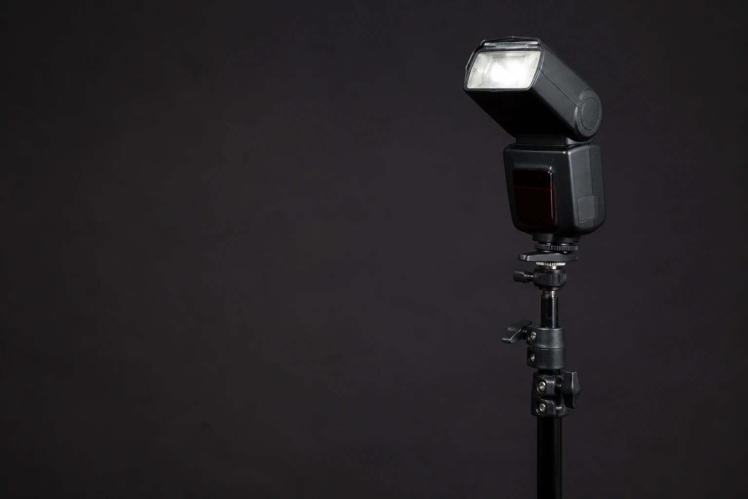 Speedlight, rigged as it is used — Speedlights are small battery flashes you can mount on-camera, bounce off architecture, or hide in small modifiers — the default tool for events…