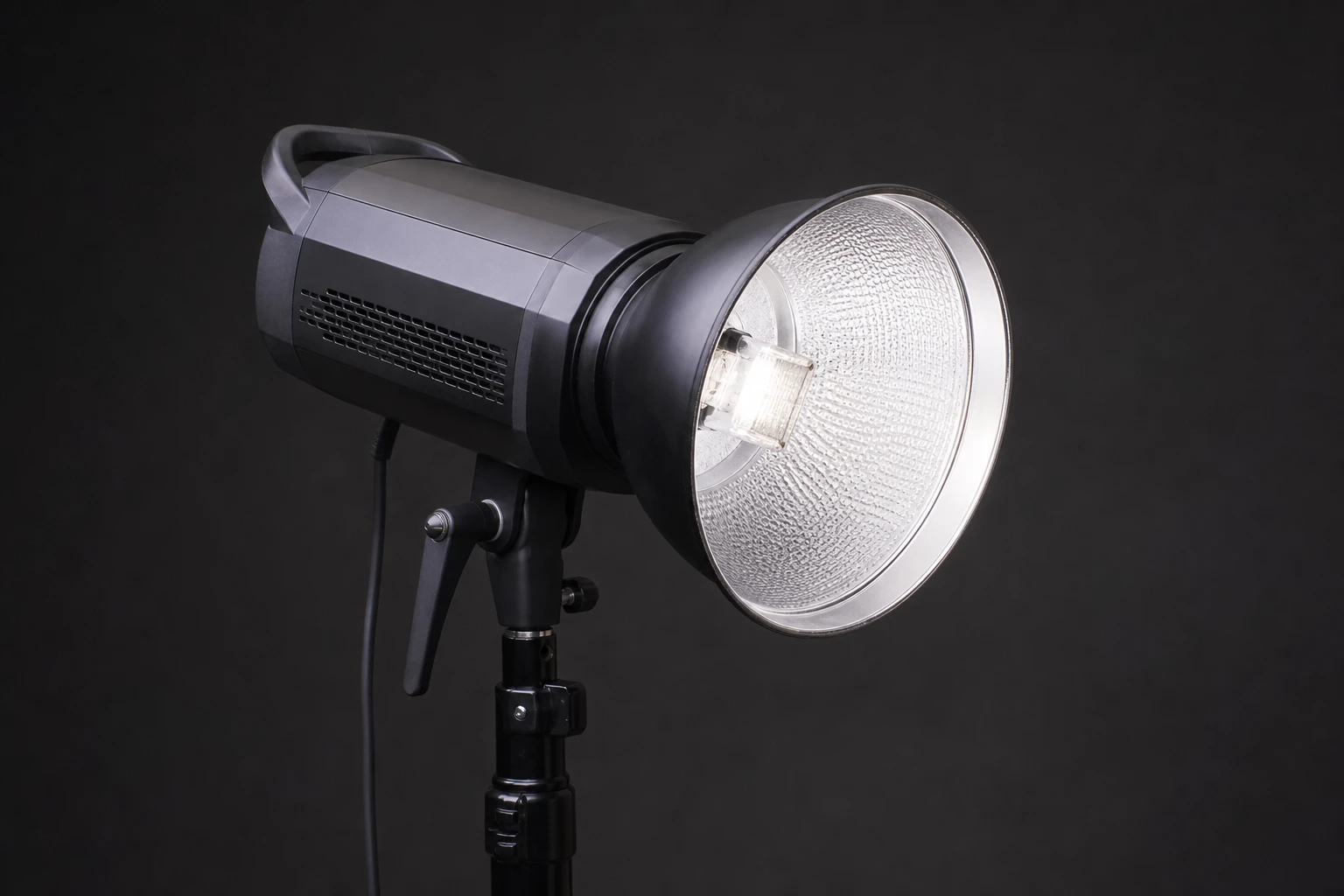 Strobe, rigged as it is used — Mains-powered flash is the workhorse of controlled studio photography: consistent color, fast recycle, and enough power to drive large modifiers wit…